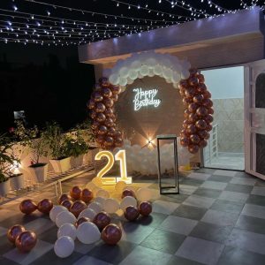 Terrace Birthday Setup with Neon & Arch Decor